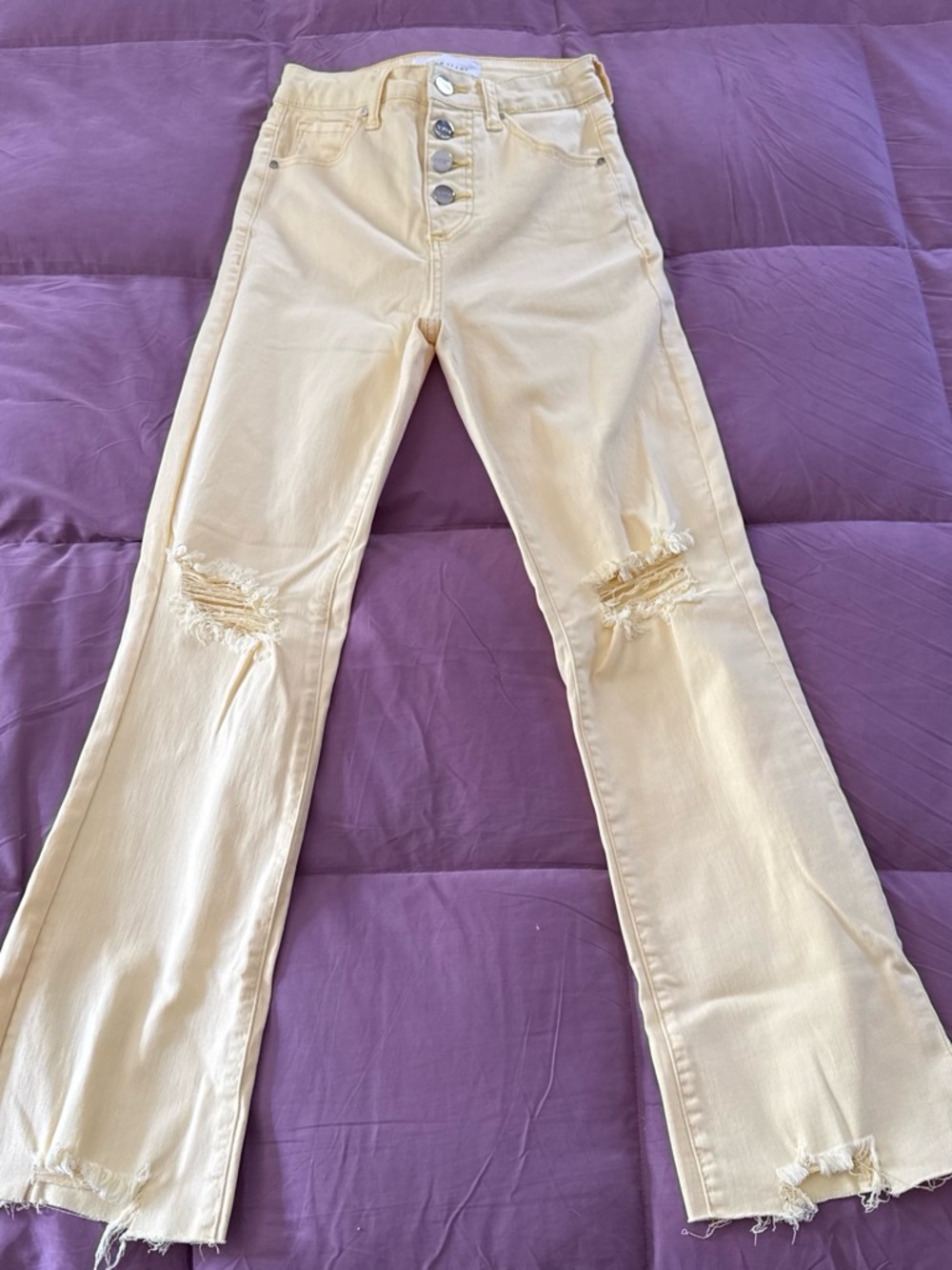 High-Rise Distressed Women's Jeans in Pale Yellow